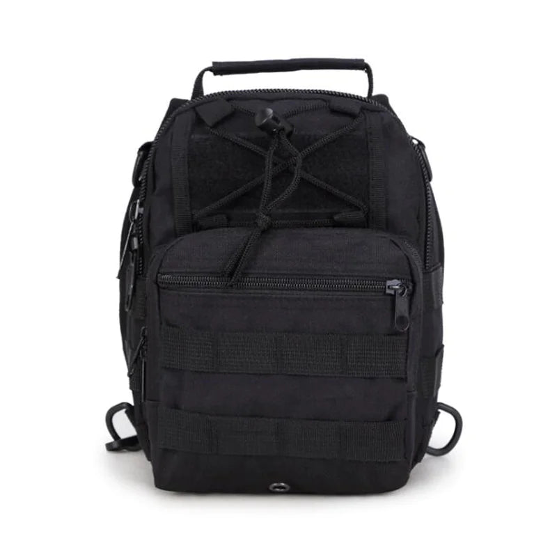 Front view of black tactical EDC sling pack showing MOLLE webbing, zippered compartments, and adjustable bungee cord system.