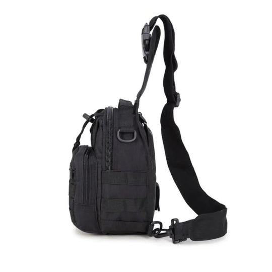 Side view of the black tactical EDC sling pack showing the zippered main compartment, MOLLE webbing, and adjustable shoulder strap.